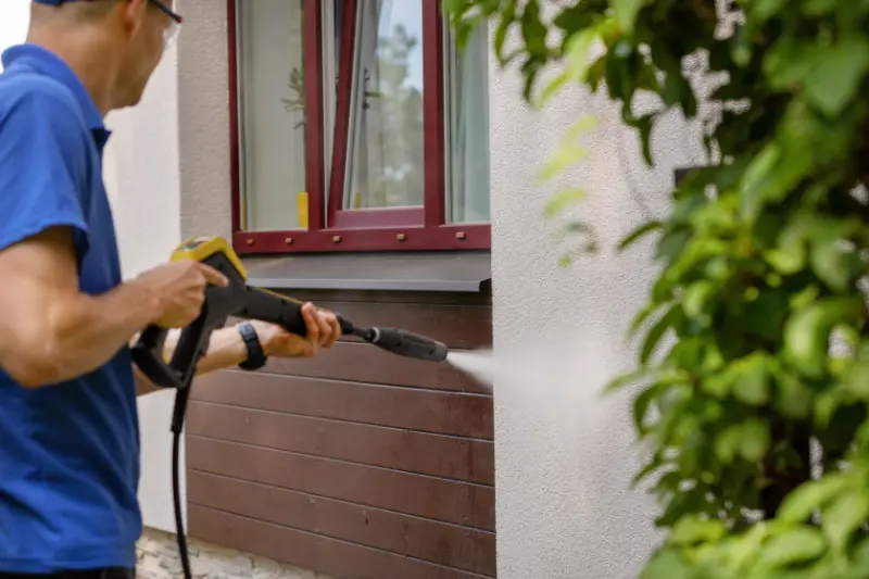 Pressure washing under window
